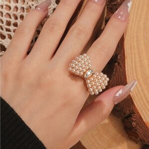 Gold Bow Ring with Diamond-like Gemstones